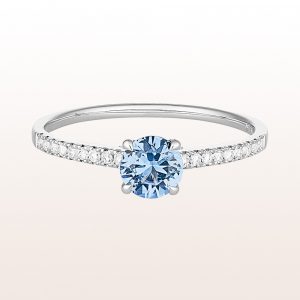 Ring with bright blue sapphire 0,53ct and brilliants 0,11ct in 18kt white gold
