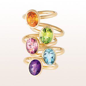 Ring-collection with mandarine-garnet, peridot, rubellite, aquamarine, amethyst in 18kt yellow-, white-, and rose gold